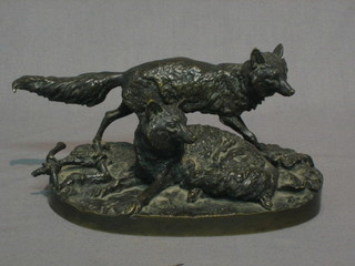 P J Mene, a cast bronze figure of a standing fox and vixen, raised on an oval naturalistic base 6 1/2" (fox loose and tail slightly bent)