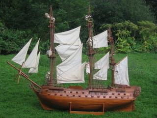 An impressive 19th/20th Century wooden model of a 3 masted 74 gunned galleon 69"
