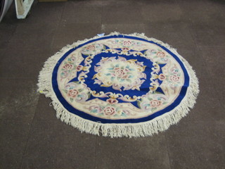 A circular blue ground floral pattern Chinese rug 49"