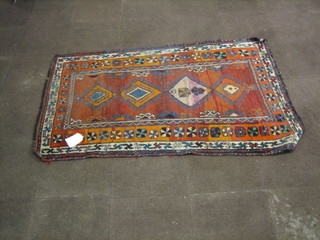 A contemporary tan ground rug with 4 diamonds to the centre, within multi-row borders 78" x 47"