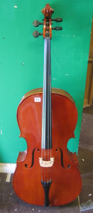 A cello with 2 piece back labelled Handarbeil Aes Mittenwald 1927
