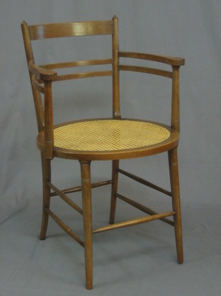 An Edwardian walnut tub ladder back chair with woven cane seat (some old worm)   