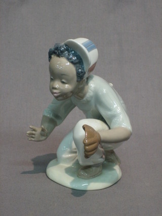A Lladro figure of a crouching baseball player 5"