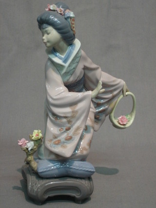 A Lladro figure of a kneeling Geisha girl with basket of flowers 8"