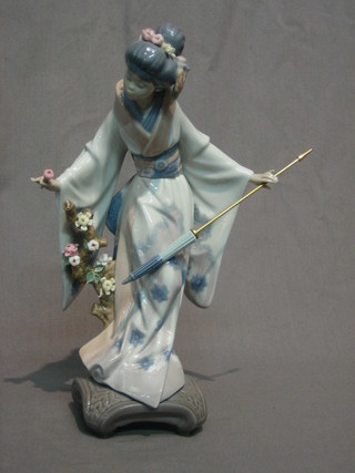 A Lladro figure of a standing Geisha Girl with parasol 10"