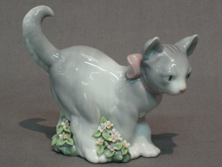 A Lladro figure of a cat with bow 4"