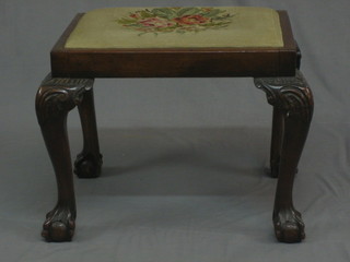 A Georgian style rectangular mahogany stool with Berlin woolwork drop in seat, raised on cabriole supports 21"