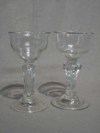 A pair of 18th Century bell shaped wine glasses with faceted stems, domed and folded foot 7"
