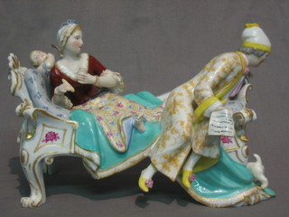 A "Meissen"  figure group of a lady and gentleman reclining on a sofa 9" (f and r)      