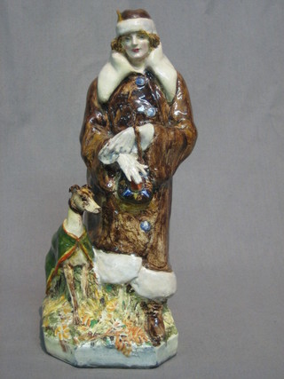 A 1920's/30's pottery figure of a standing lady with greyhound, the base marked S K Cope, Burslem no. 1, 9"