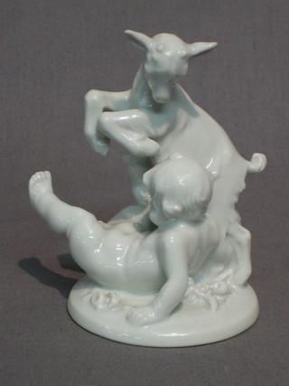 A late Austrian blanc de chine porcelain figure group of a cherub and goat 4"