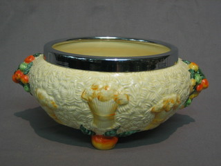 A circular Clarice Cliff Harvest ware pottery bowl with silver plated rim 10"