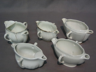 5 French white glazed porcelain twin handled double ended sauce pots