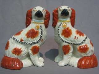 A pair of 19th Century Staffordshire figures of seated Spaniels 10"