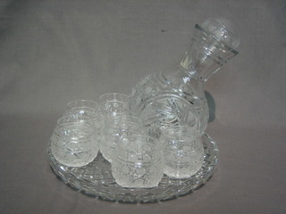 An Eastern cut glass water set with decanter, 6 beakers and matching tray