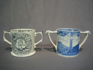 A 1974 Wade Pottery limited edition twin handled cider mug with blue and white decoration to commemorate Taunton's oldest cider Company 1973 and a black glazed ditto