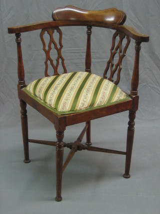 An Edwardian inlaid mahogany corner chair with pierced vase shaped splat back