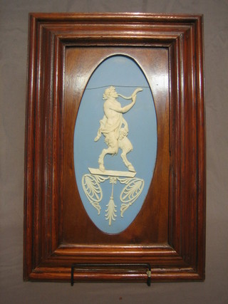 A blue and white "Jasperware" plaque decorated a faun 13" oval (f) framed