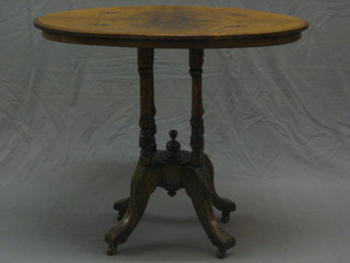 A Victorian inlaid walnut Loo table, raised on floral turned columns 33"