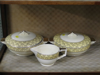 A 23 piece Art Deco mid-winter pottery dinner service comprising 2 circular tureens and covers (1 cracked), 3 graduated pottery meat plates (2 cracked), sauce boat, 6  circular dinner plates  10â€ (3 cracked), 6  side plates 9â€ (1 cracked), 6  tea plates  8â€ (3 cracked)