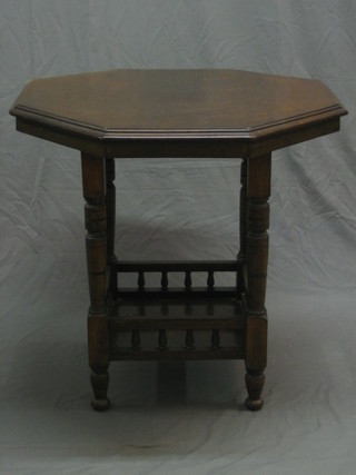 An Edwardian octagonal mahogany occasional table, raised on turned supports 29"