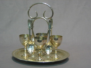 A silver plated 3 piece egg cruet and 4 silver spoons Birmingham 1936