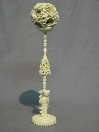 A carved ivory puzzle ball 2"