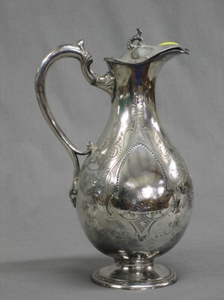 An engraved Britannia metal hotwater jug