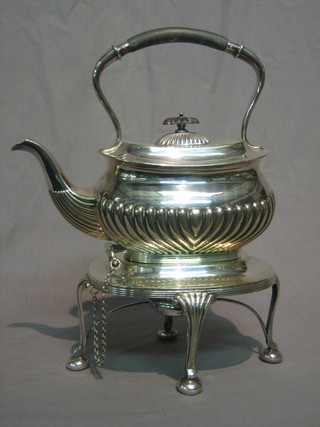 An oval sea plated tea kettle with demi-reeded decoration raised on a stand complete with burner