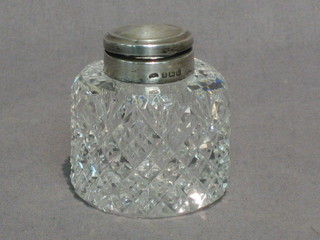 A circular cut glass inkwell with plain silver lid, Birmingham 1919 2"