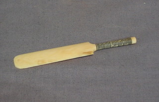 A miniature ivory cricket bat 3 1/2"