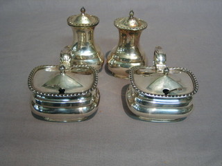 A silver plated 3 piece condiment set with 2 pepper pots and a mustard pot