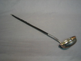 A silver plated toddy ladle with whale bone handle