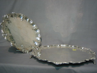 A silver plated salver with bracketed border, raised on 3 ball and claw supports 15" and 1 other salver 12"