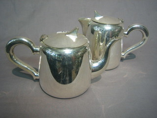 An Art Deco 2 piece silver plated hotelware hotwater jug and cream jug