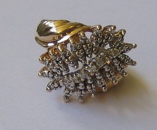 A 10ct gold dress ring set numerous diamonds