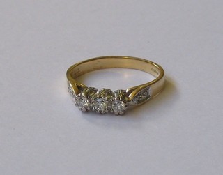 A lady's 18ct gold dress ring set 3 diamonds and 6 diamonds to the shoulders