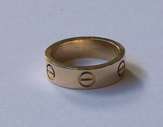 A Cartier 18ct band ring marked Cartier G09008 53