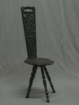 A carved oak spinning chair