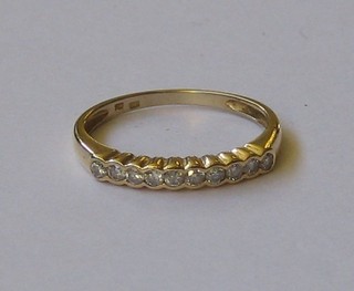 A lady's 18ct gold half eternity ring set 10 small diamonds