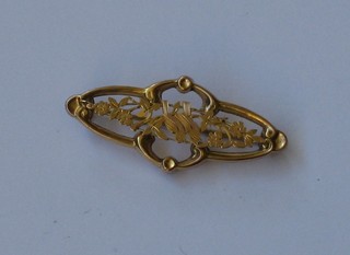 An Edwardian pierced 9ct gold bar brooch decorated 2 love birds