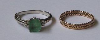 A lady's 18ct white gold dress ring set a  green coloured stone together with a gold band (2)