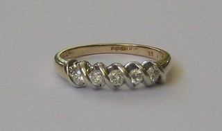 A lady's 9ct gold dress ring set 5 diamonds