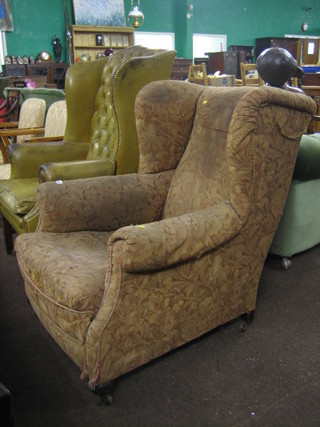 A mahogany winged armchair