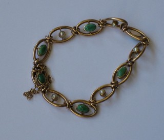 A 15ct gold bracelet set green cabouchon hard stones and demi-pearls