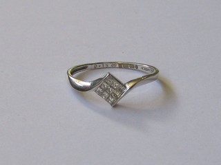 A lady's 18ct white gold dress ring set 9 diamonds