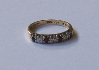A lady's 18ct gold ruby and diamond set half eternity ring
