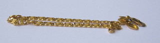 A modern Continental gold flat link bracelet marked 915