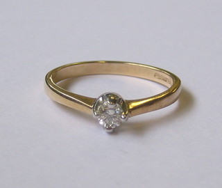 An 18ct gold dress ring set a solitaire diamond