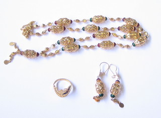 A suite of Eastern gold jewellery comprising necklace, ring and earrings
